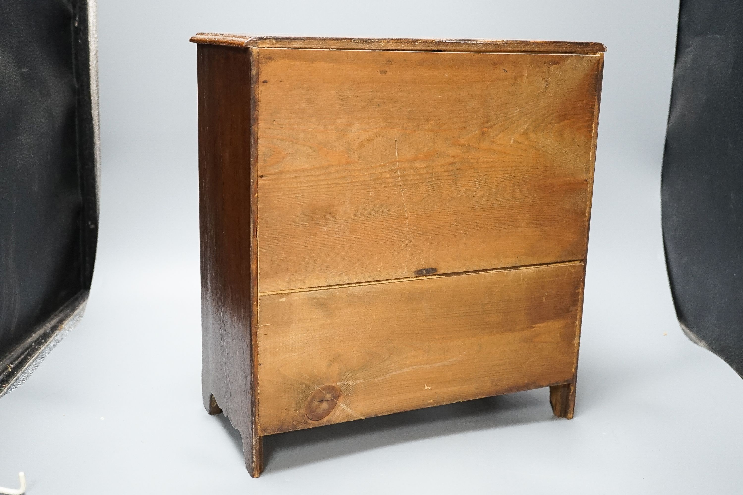 A 19th century mahogany miniature chest of drawers 35cm high, 33cm wide